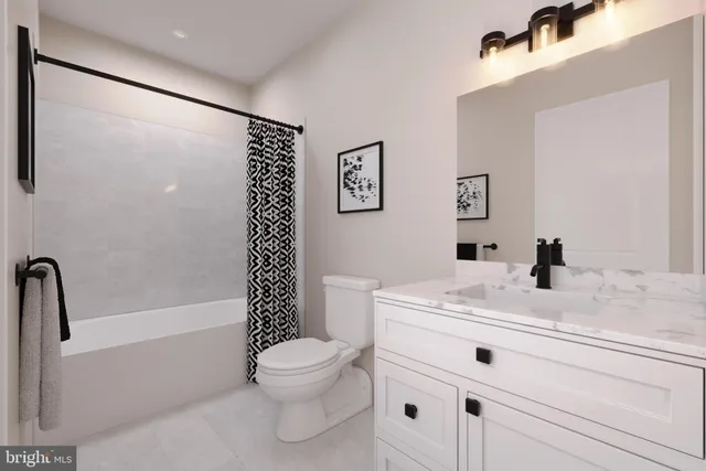 a bathroom with a sink a toilet and a bathtub