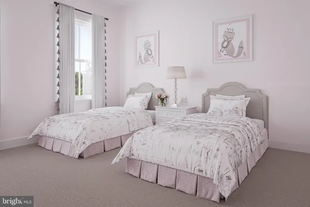 a bedroom with two beds and painting on the wall