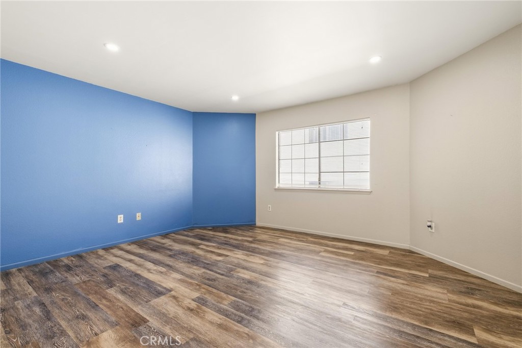 14429 Chardon Avenue, Unit 41 Hawthorne, CA 90250 - Photo 12 of 27 wooden floor in an empty room with a window