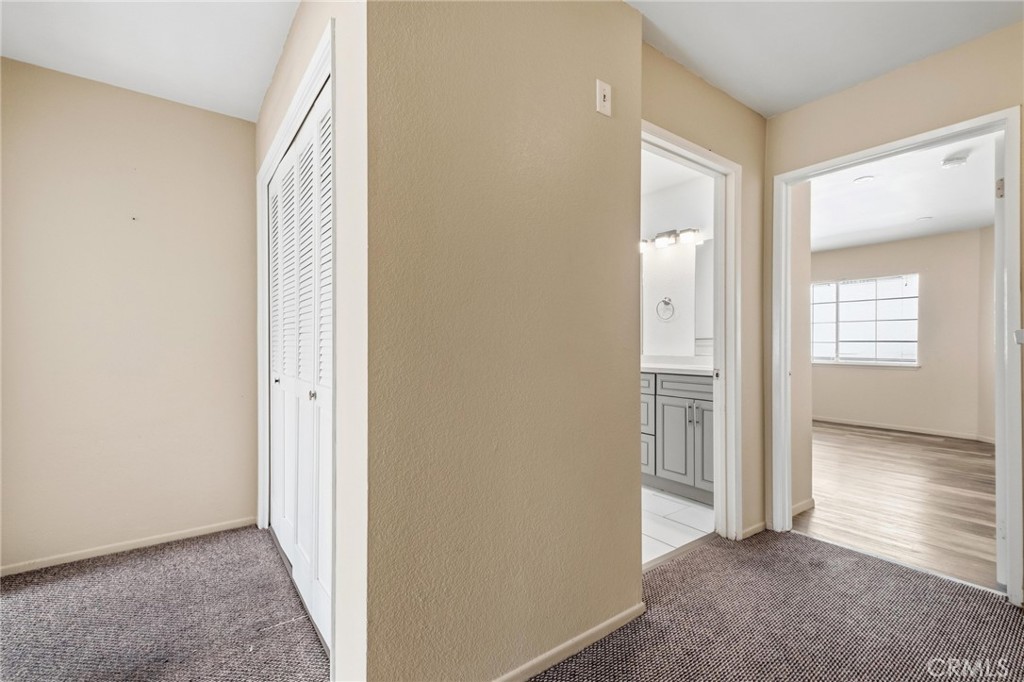 14429 Chardon Avenue, Unit 41 Hawthorne, CA 90250 - Photo 22 of 27 an entryway with a glass door and a window
