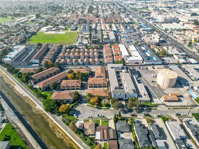 an aerial view of residential houses with outdoor space