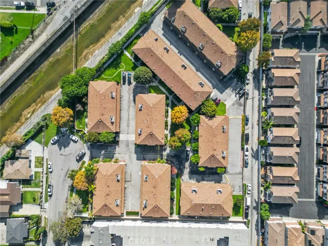 an aerial view of residential houses with outdoor space