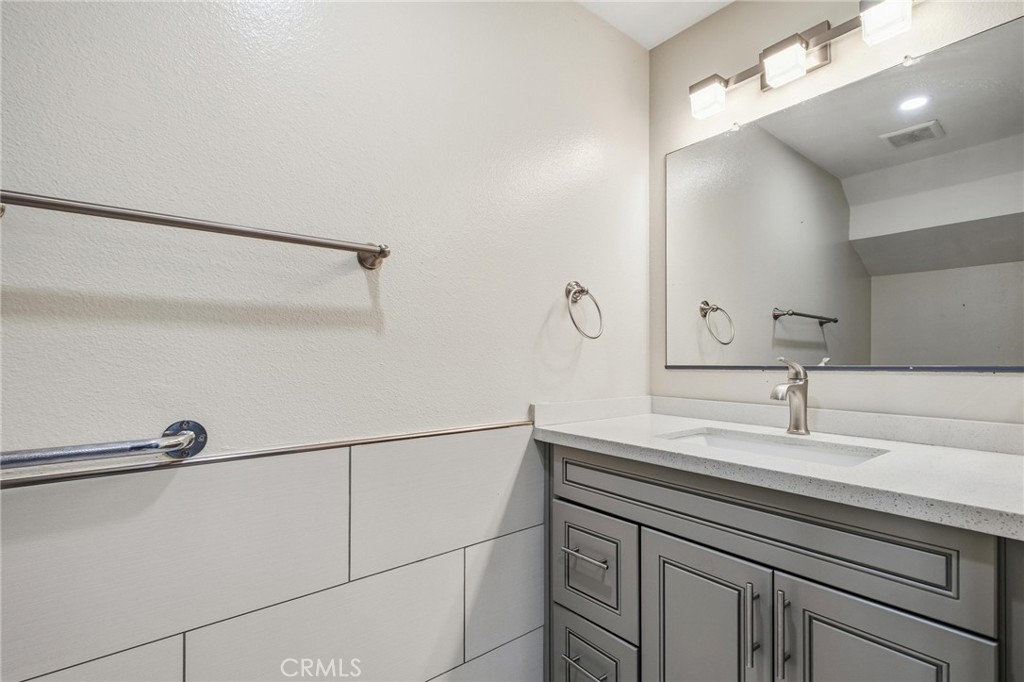14429 Chardon Avenue, Unit 41 Hawthorne, CA 90250 - Photo 9 of 27 a bathroom with a sink and a mirror