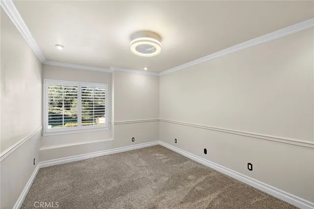 an empty room with a empty space and windows