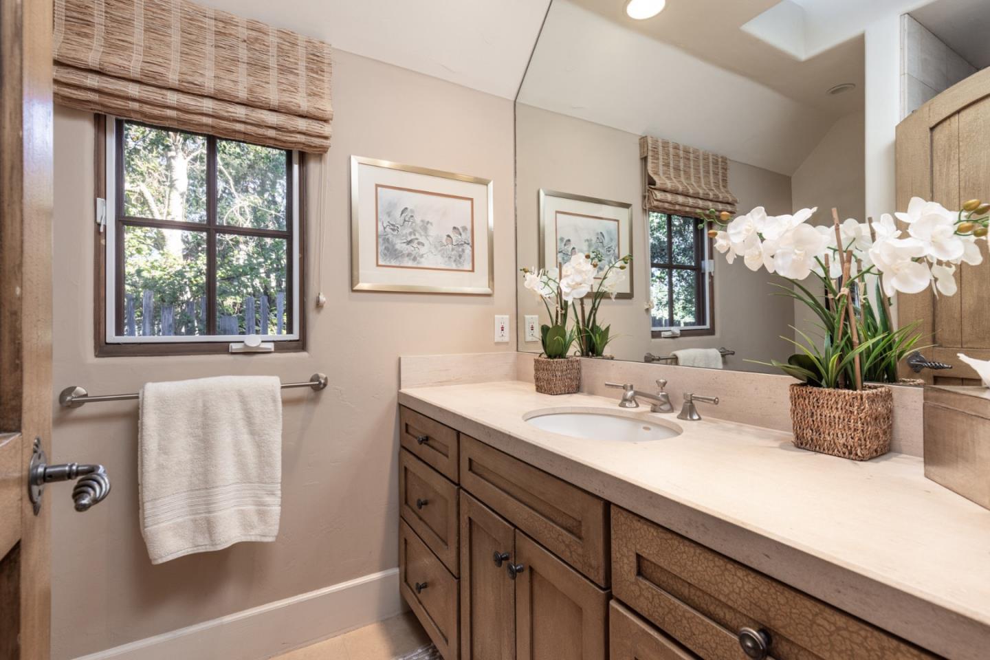 0 Southeast Corner Of Monte Verde & 10th Avenue Carmel, CA 93921 - Photo 15 of 24 a bathroom with a sink a vanity and a large mirror