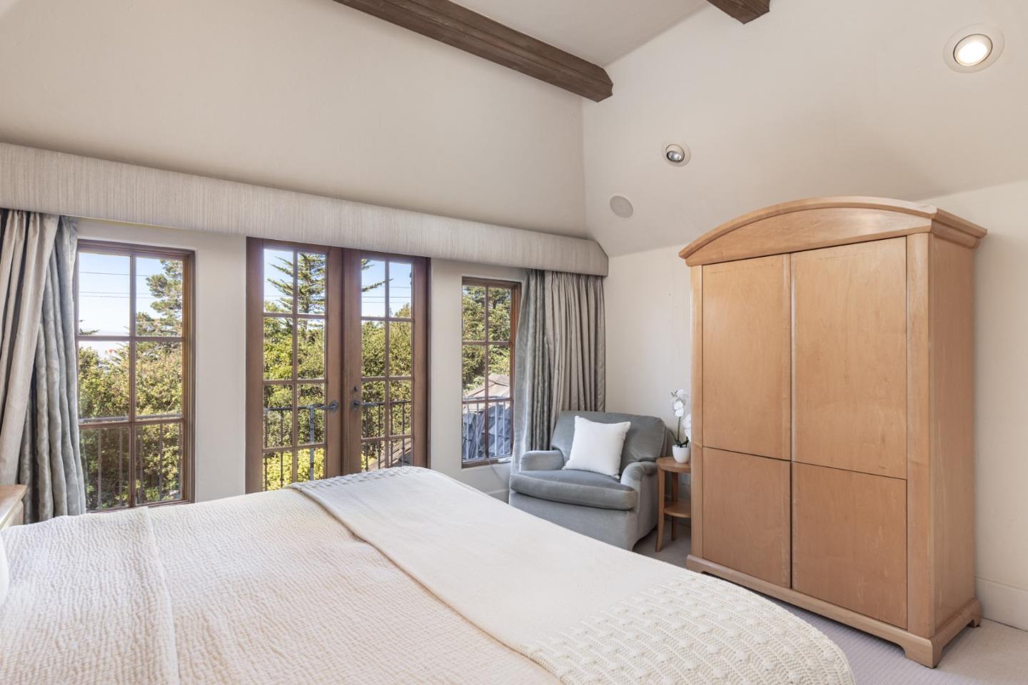 0 Southeast Corner Of Monte Verde & 10th Avenue Carmel, CA 93921 - Photo 18 of 24 a spacious bedroom with a bed and a window
