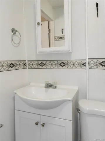 a bathroom with a sink and mirror