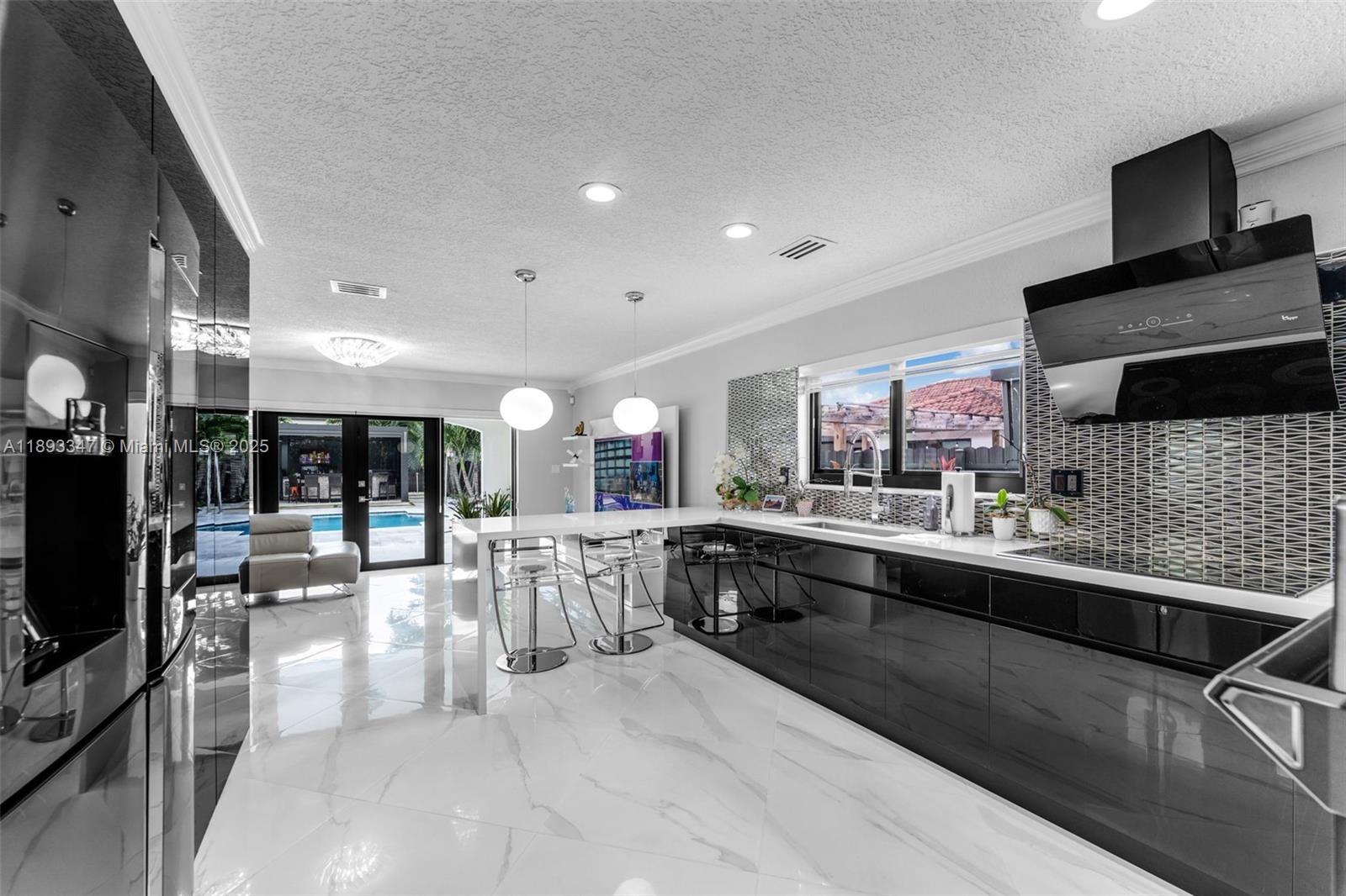 3121 Southwest 151st Court Miami, FL 33185 - Photo 12 of 37 a large kitchen with stainless steel appliances lots of counter top space