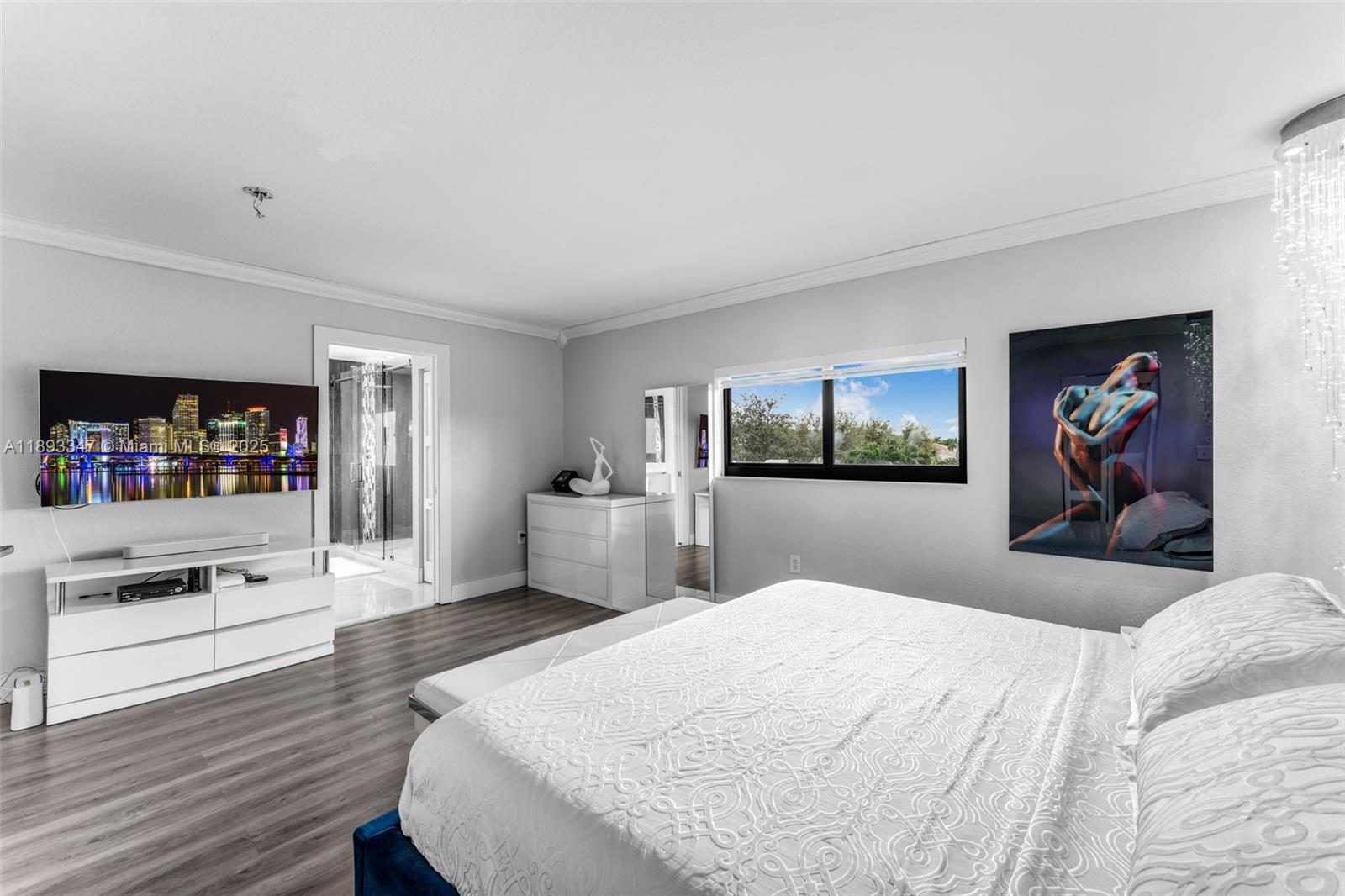 3121 Southwest 151st Court Miami, FL 33185 - Photo 15 of 37 a bedroom with a bed and a flat screen tv