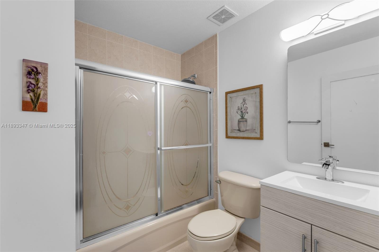 3121 Southwest 151st Court Miami, FL 33185 - Photo 22 of 37 a bathroom with a sink a toilet and shower