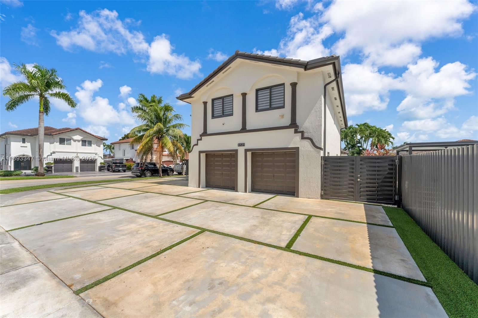 3121 Southwest 151st Court Miami, FL 33185 - Photo 3 of 37 a front view of a house with a yard