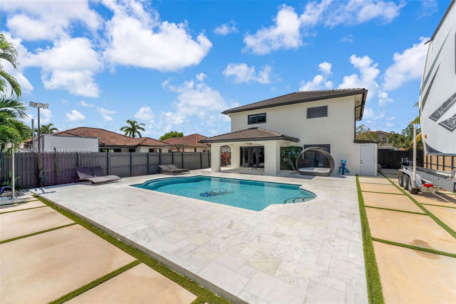 3121 Southwest 151st Court Miami, FL 33185 - Photo 32 of 37 a view of a white house with a patio