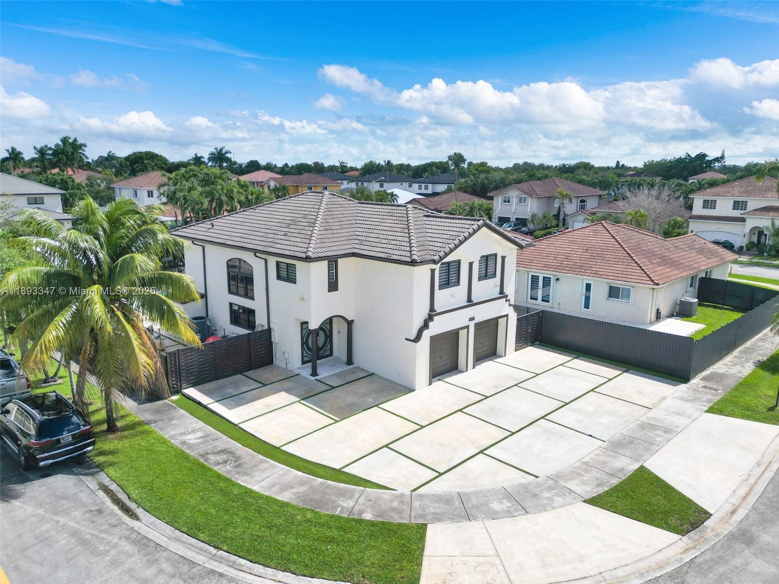 3121 Southwest 151st Court Miami, FL 33185 - Photo 36 of 37 a view of a white house with a yard