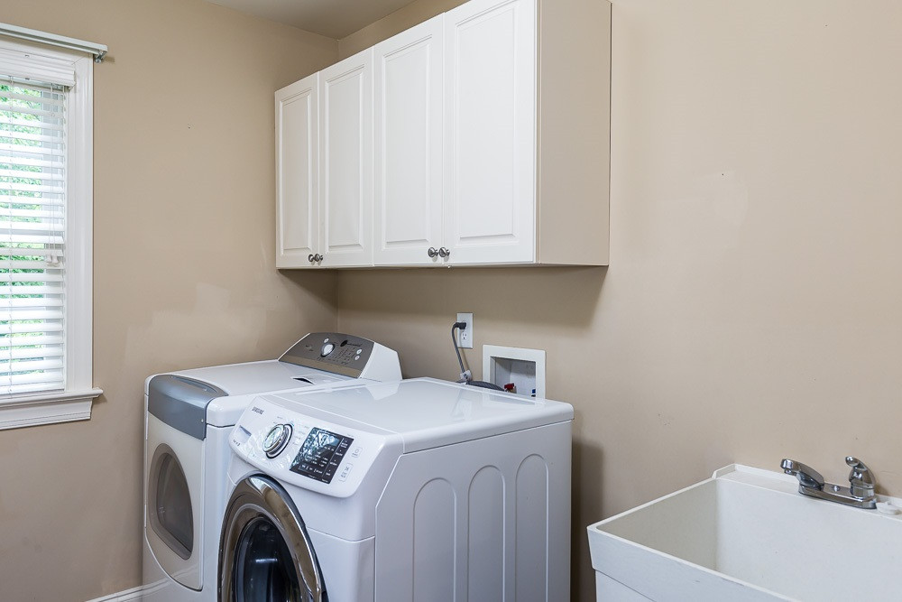 8415 Wheatstone Lane Raleigh, NC 27613 - Photo 24 of 30 Chores are chores when you enjoy natural light, lots of room for sorting and a SINK! Laundry Room