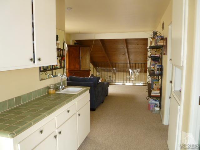 1421 Mandalay Beach Road Oxnard, CA 93035 - Photo 14 of 27 a kitchen with a sink and a refrigerator