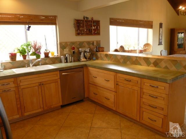 1421 Mandalay Beach Road Oxnard, CA 93035 - Photo 4 of 27 a bathroom with a sink and large mirror