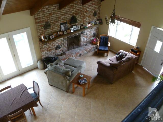 1421 Mandalay Beach Road Oxnard, CA 93035 - Photo 7 of 27 a living room with furniture and a fireplace
