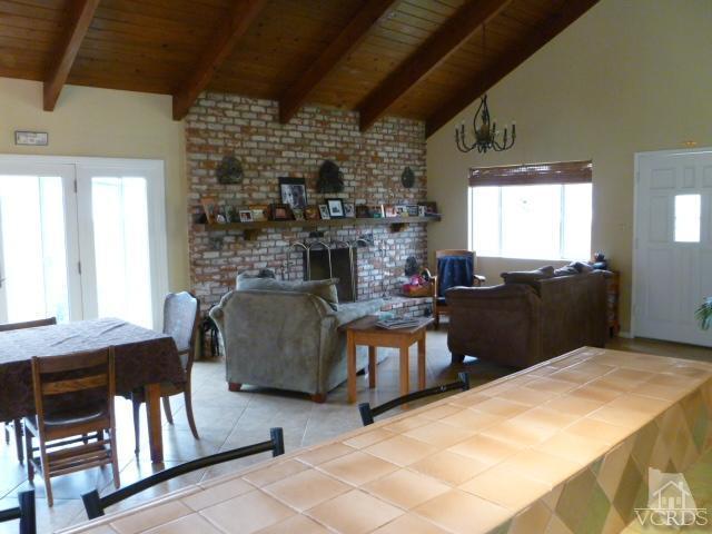 1421 Mandalay Beach Road Oxnard, CA 93035 - Photo 8 of 27 a living room with furniture and a fireplace