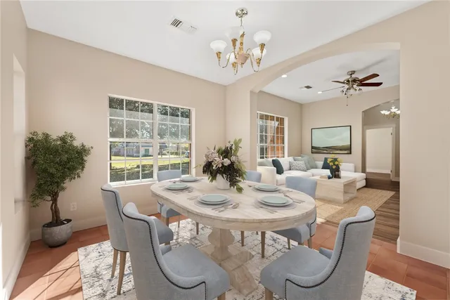 a view of a dining room with furniture window and outside view