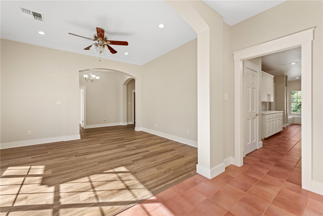 417 Morgan Street Franklin, TX 77856 - Photo 13 of 42 a view of a hallway view with wooden floor and staircase