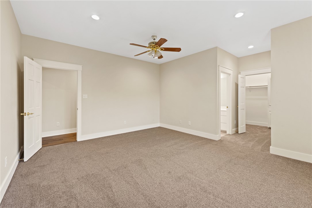 417 Morgan Street Franklin, TX 77856 - Photo 33 of 42 an empty room with closet and a ceiling fan