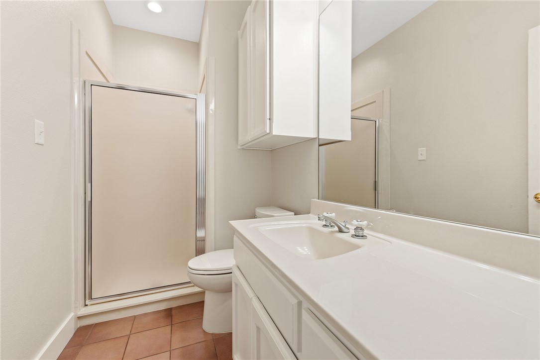 417 Morgan Street Franklin, TX 77856 - Photo 37 of 42 a bathroom with a sink a toilet and vanity
