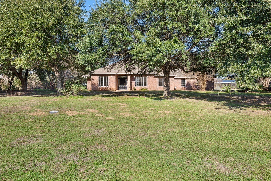 417 Morgan Street Franklin, TX 77856 - Photo 5 of 42 a house view with swimming pool in front of it