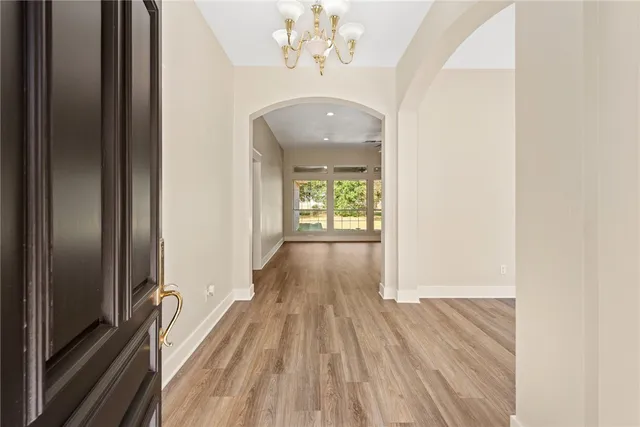a view of an entryway with wooden floor