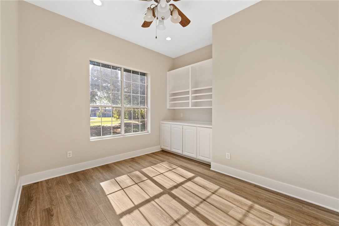 417 Morgan Street Franklin, TX 77856 - Photo 9 of 42 a view of an empty room with a window