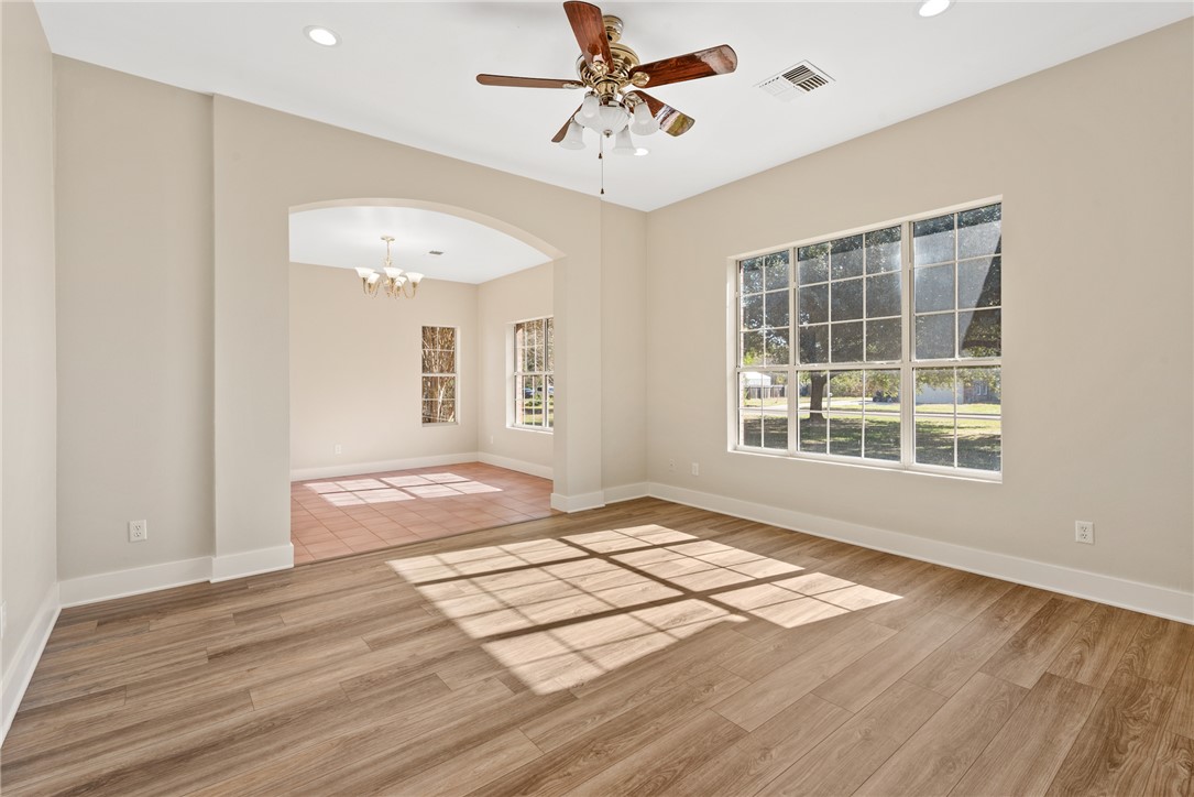 417 Morgan Street Franklin, TX 77856 - Photo 10 of 42 a view of an empty room with wooden floor and a window