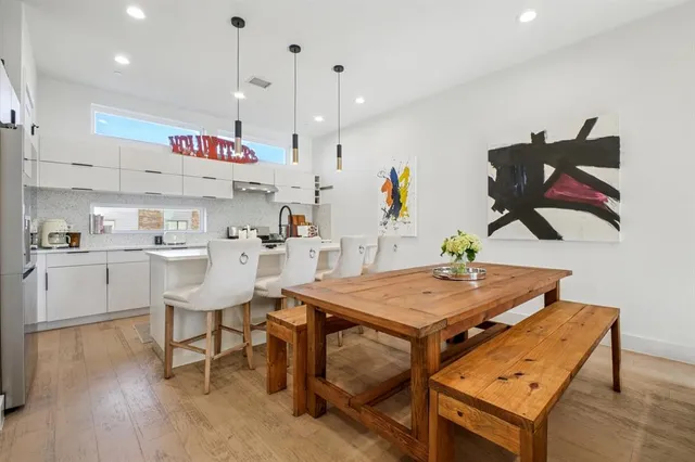 a kitchen with a table and chairs in it