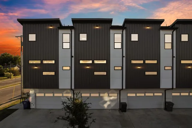 a front view of a house with a street