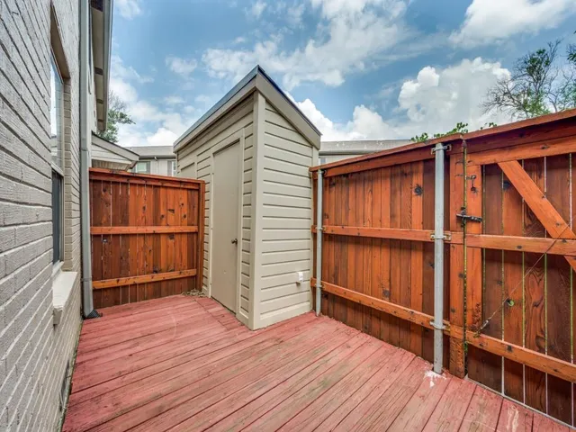 a backyard of a house with wooden floor