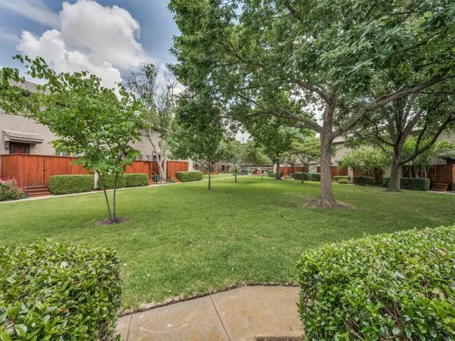 a view of a back yard of the house
