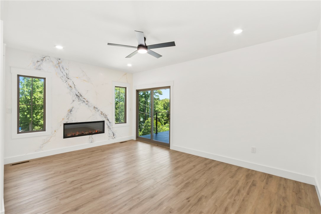 230 Hammond Circle Anderson, SC 29621 - Photo 11 of 48 This bright living space features a striking fireplace and expansive views.