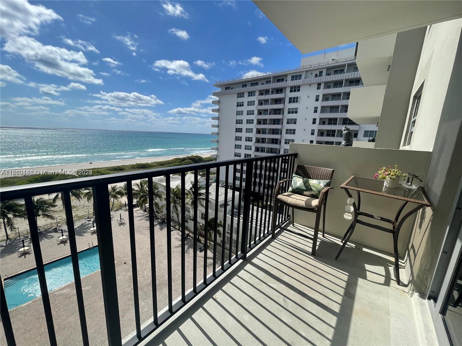 9273 Collins Avenue, Unit 811 Surfside, FL 33154 - Photo 2 of 25 a view of balcony with a potted plant and outdoor seating