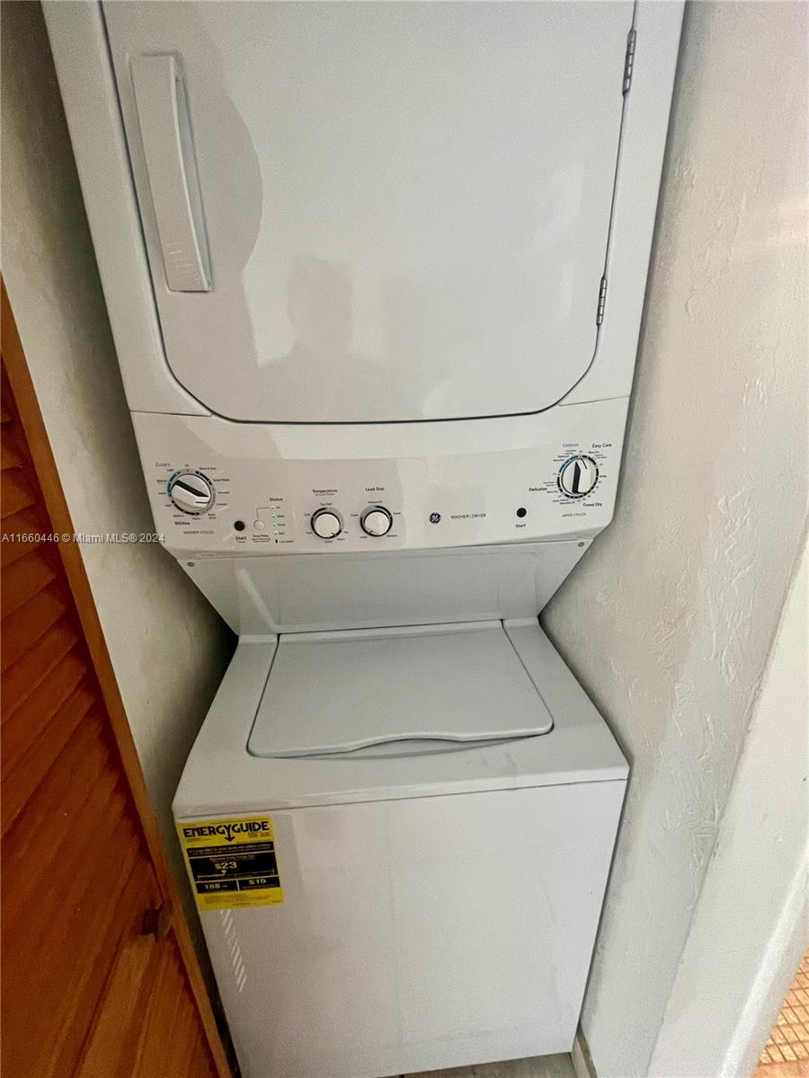9273 Collins Avenue, Unit 811 Surfside, FL 33154 - Photo 21 of 25 a utility room with dryer and washer