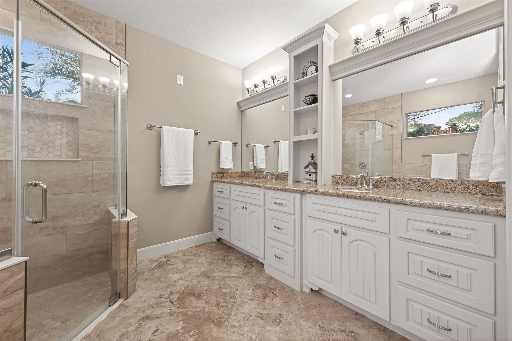 112 Timberside Drive Conroe, TX 77304 - Photo 25 of 50 a spacious bathroom with a granite countertop sink mirror and shower