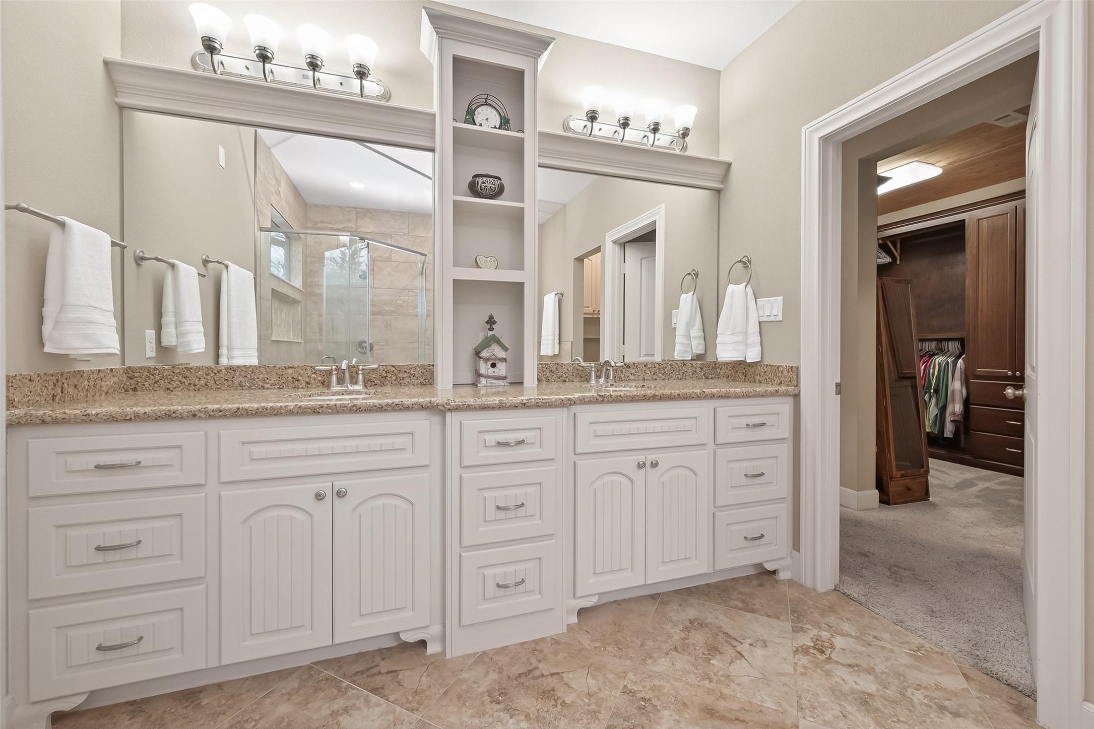 112 Timberside Drive Conroe, TX 77304 - Photo 27 of 50 a spacious bathroom with a granite countertop sink mirror and