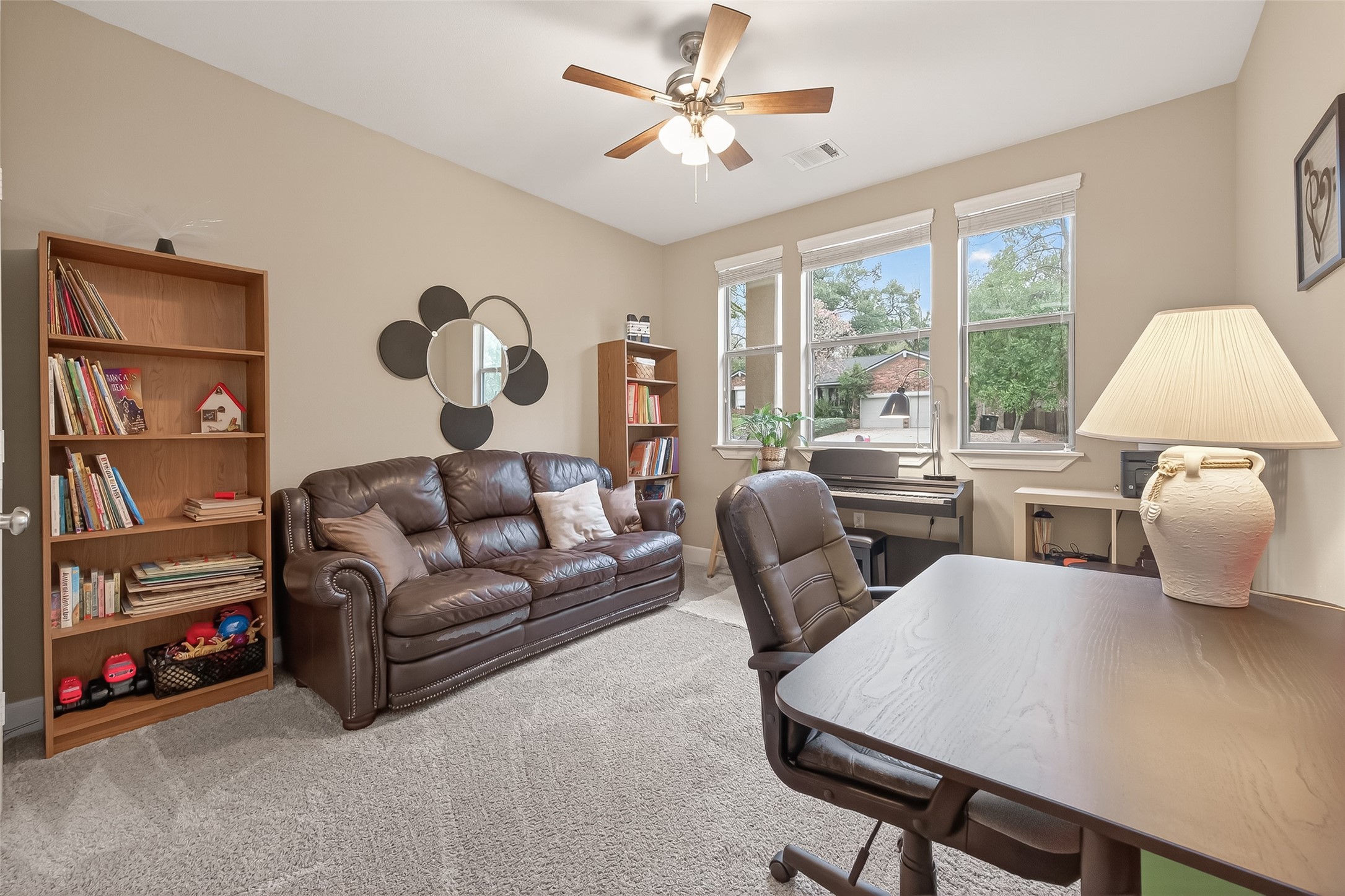 112 Timberside Drive Conroe, TX 77304 - Photo 32 of 50 a living room with furniture and a large window