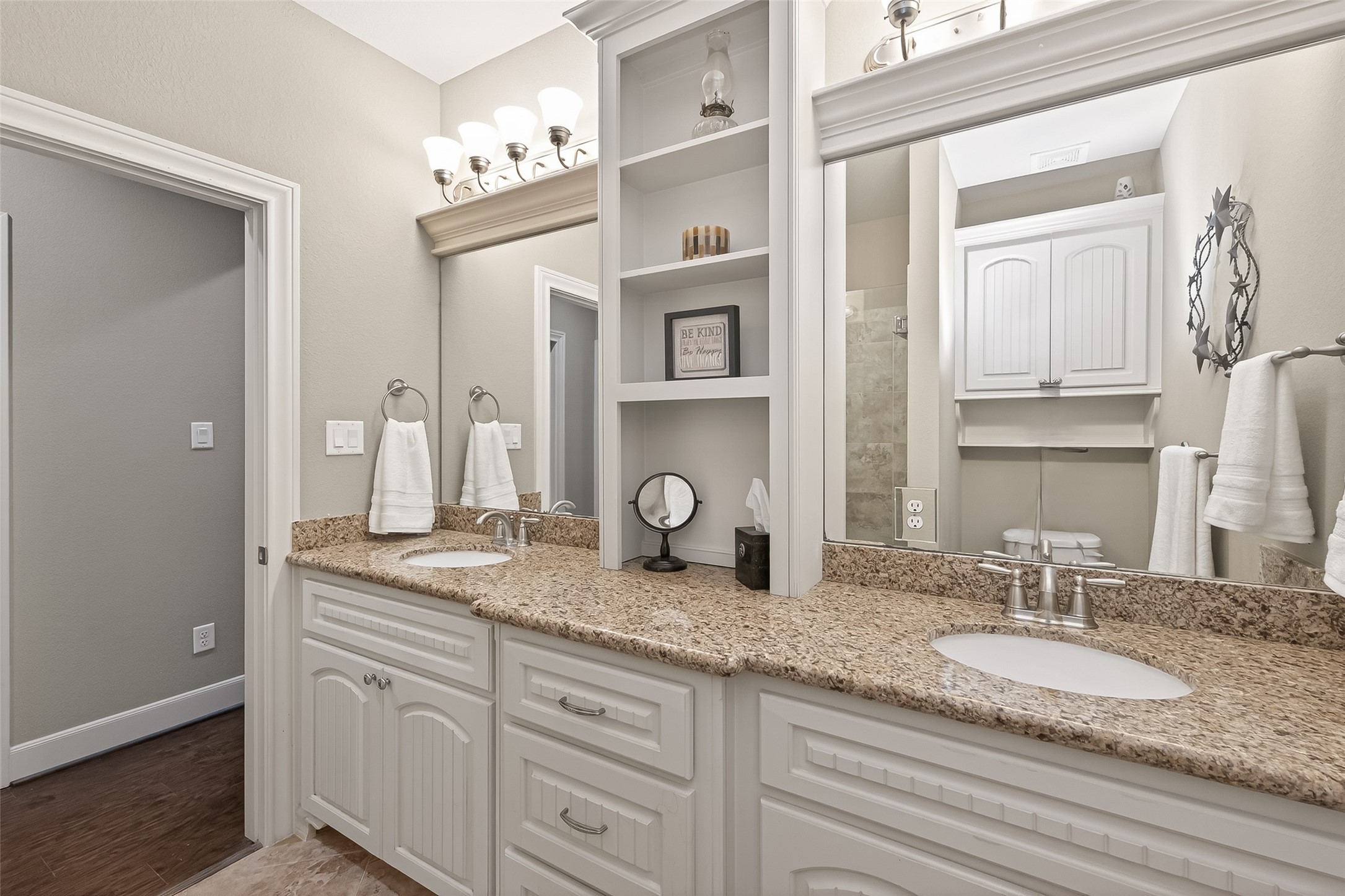 112 Timberside Drive Conroe, TX 77304 - Photo 33 of 50 a bathroom with cabinets granite and a sink