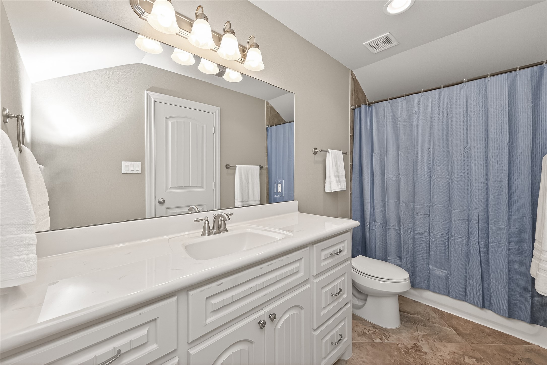 112 Timberside Drive Conroe, TX 77304 - Photo 40 of 50 a bathroom with a sink a toilet and a large mirror