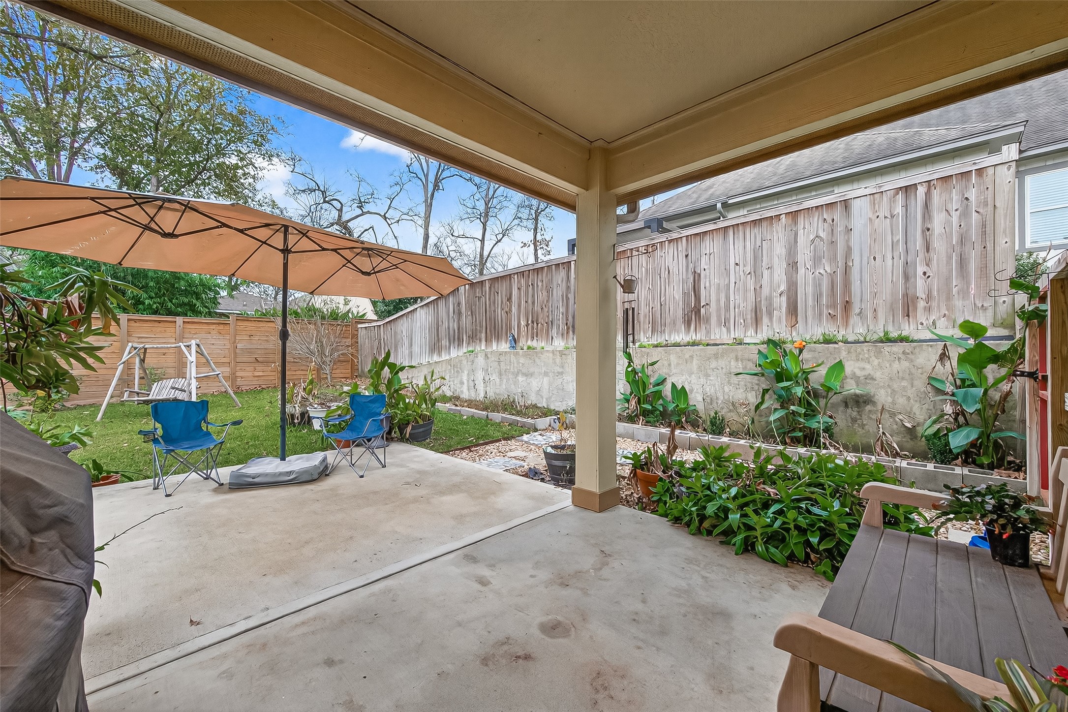 112 Timberside Drive Conroe, TX 77304 - Photo 42 of 50 Extended covered concrete pad
