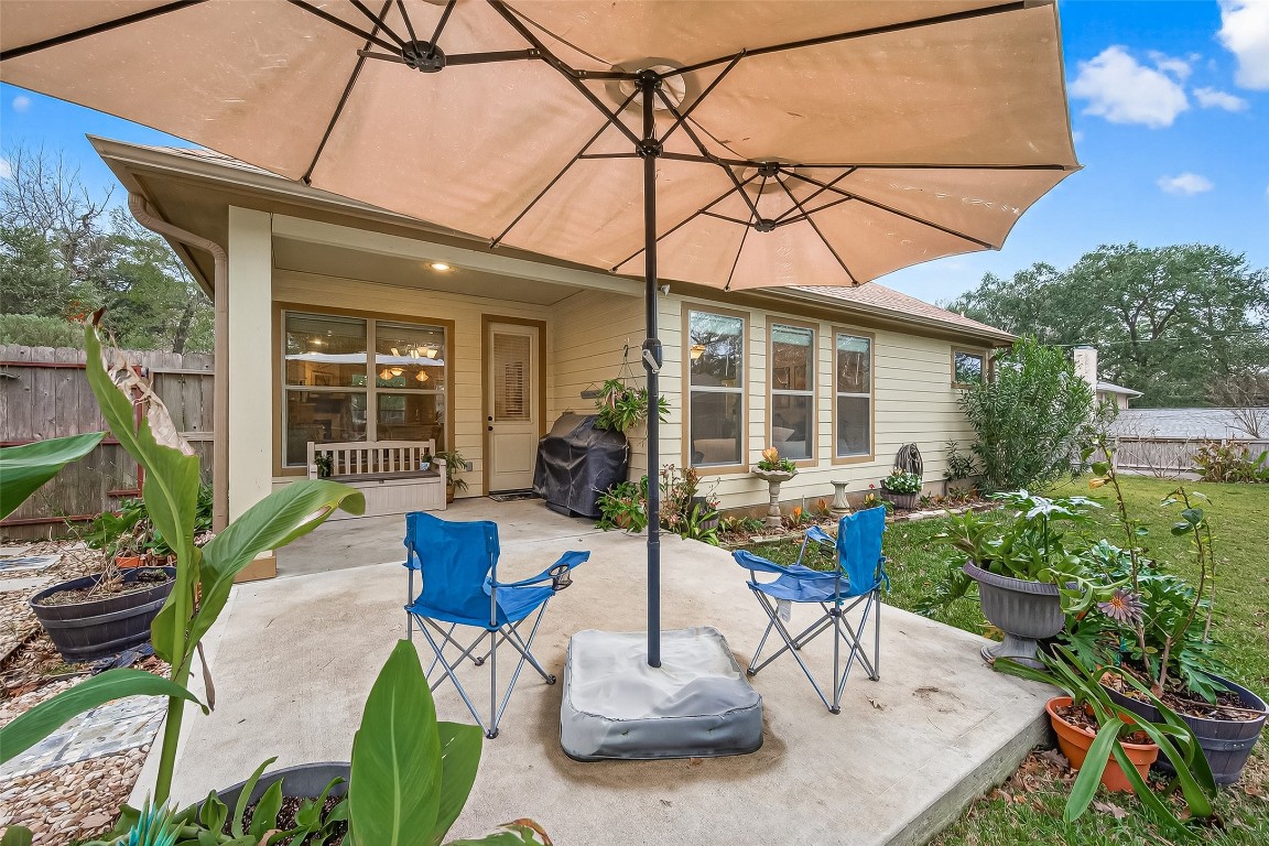112 Timberside Drive Conroe, TX 77304 - Photo 45 of 50 a view of a patio with couches table and chairs and potted plants
