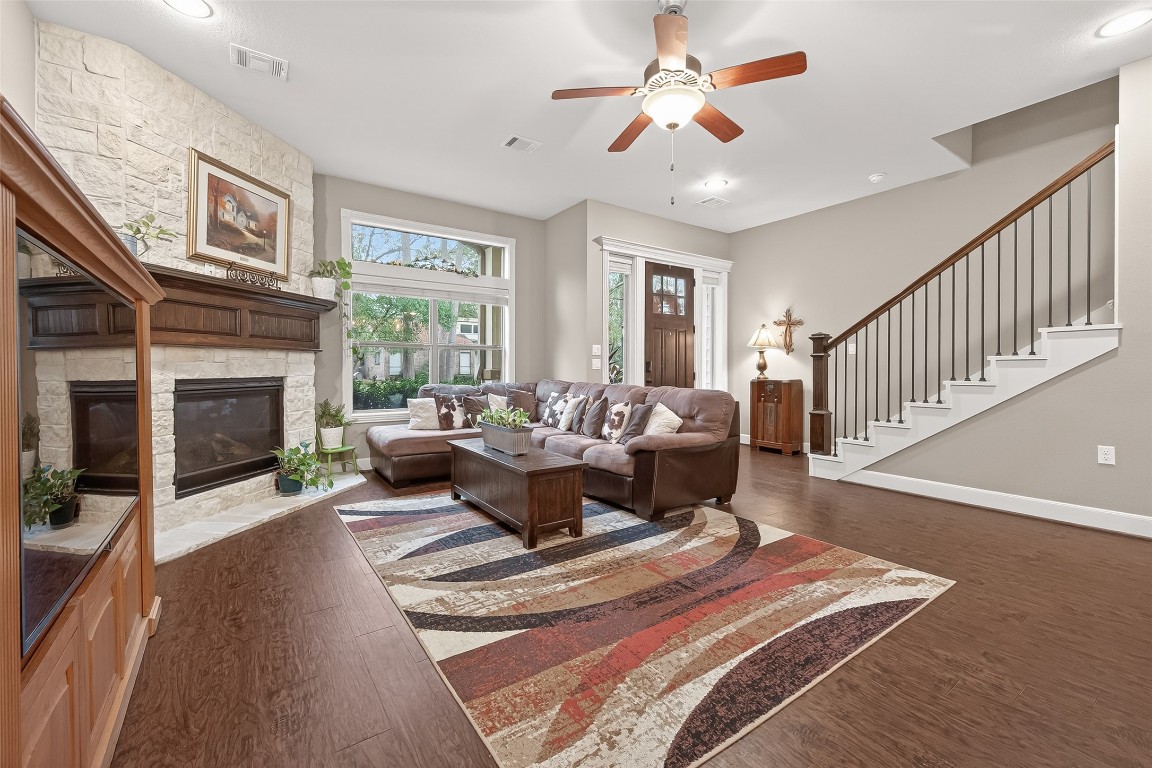 112 Timberside Drive Conroe, TX 77304 - Photo 7 of 50 a living room with furniture fireplace and a large window