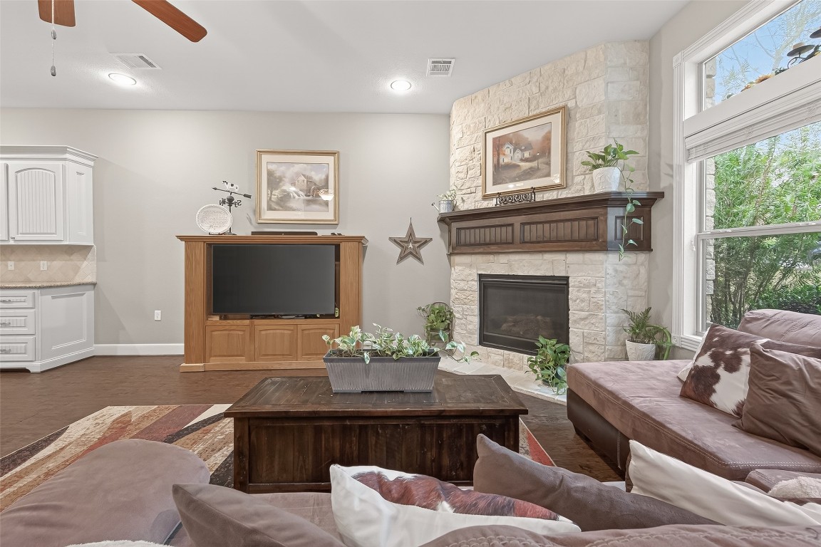 112 Timberside Drive Conroe, TX 77304 - Photo 50 of 50 a living room with furniture a fireplace and a flat screen tv