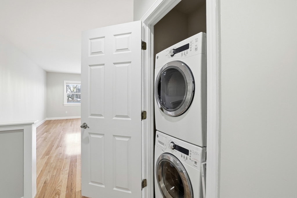 74 Branch Street, Unit 15 Scituate, MA 02066 - Photo 17 of 26 a view of a hallway with washer and dryer