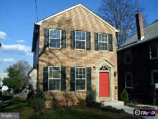 611 Providence Road Media, PA 19063 - Photo 1 of 1 a view of a white house with large windows and a small yard