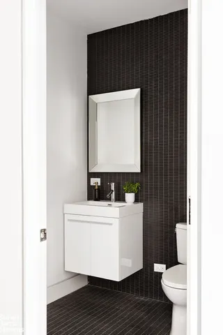 a kitchen with a refrigerator and a sink