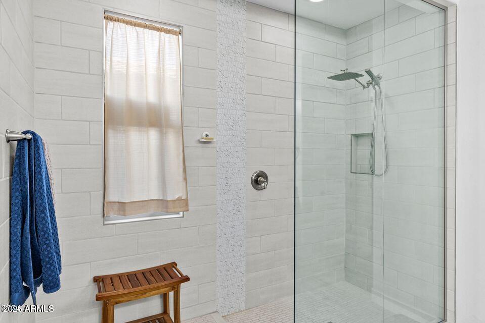 40990 West Agave Road Maricopa, AZ 85138 - Photo 9 of 18 a bathroom with a shower and a sink